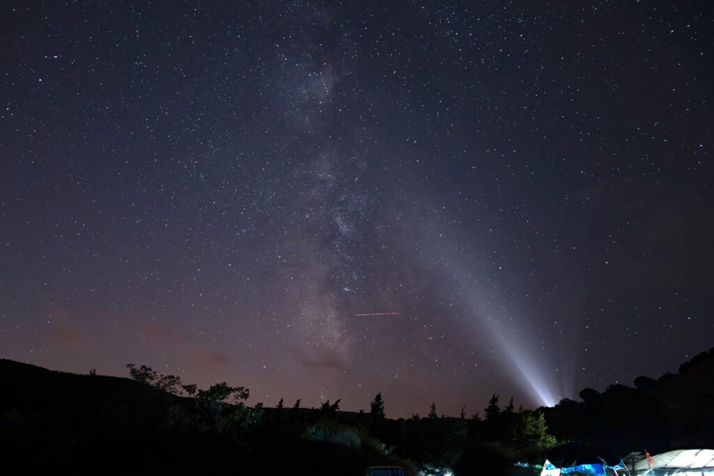Beautiful night sky with Milky Way visible over rural Türkiye landscape.